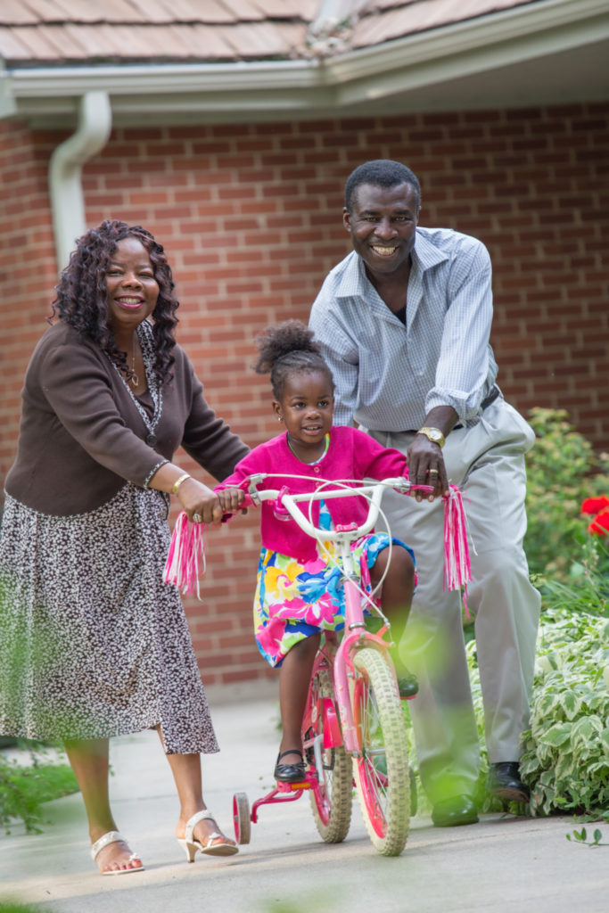 african-family-with-girl-on-bike